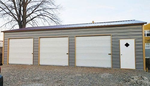 Gray garage building with white doors