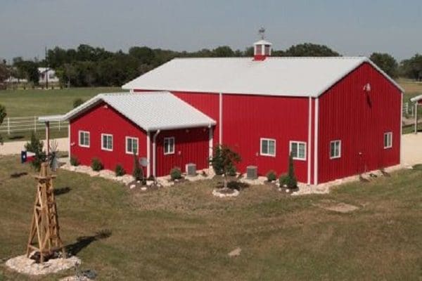Rural red barn in open field