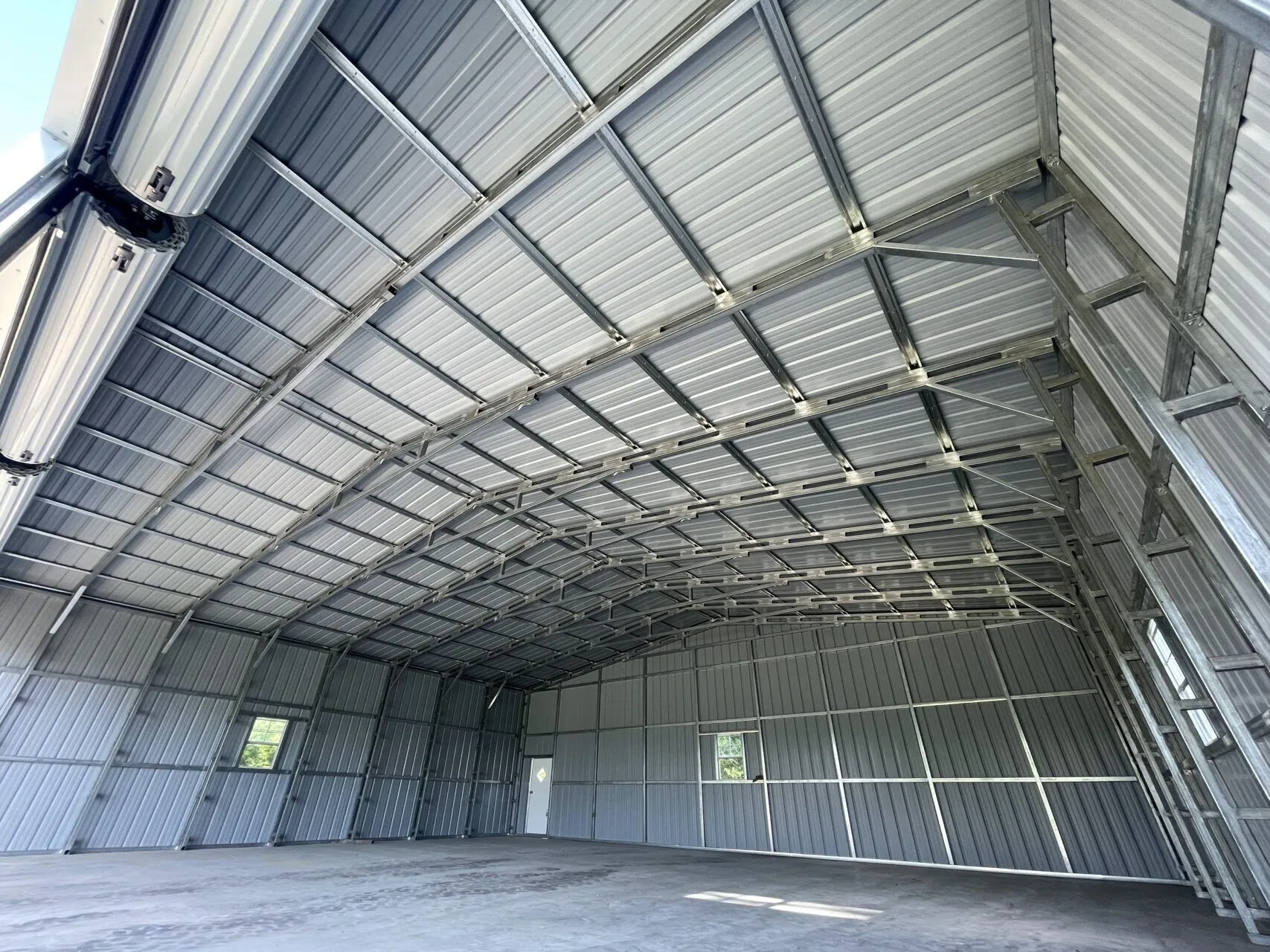 Interior of large, empty metal warehouse