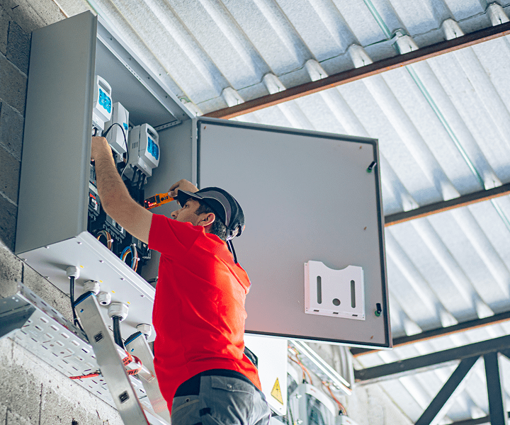 Technician inspecting electrical equipment