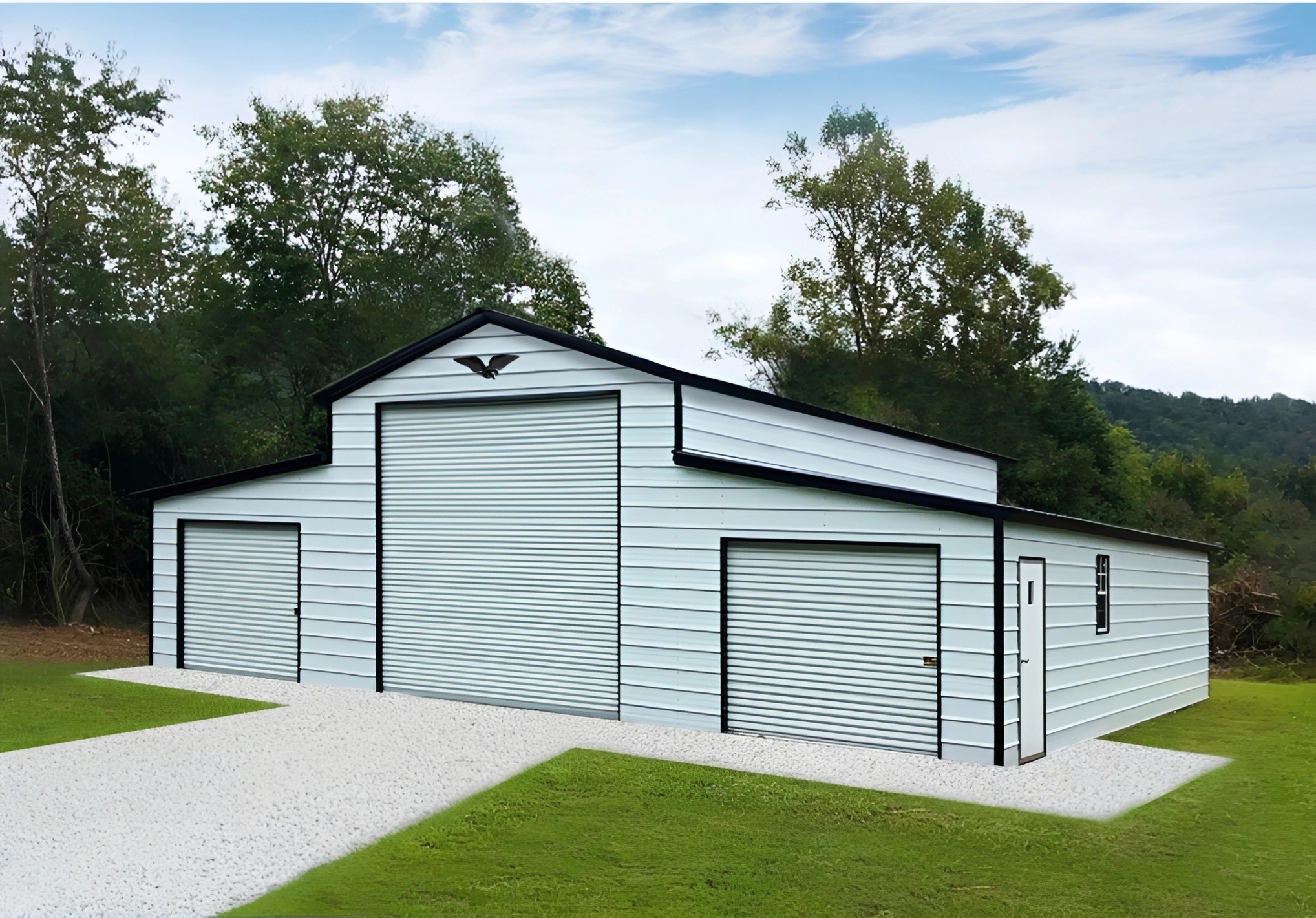Large white metal barn with garage doors
