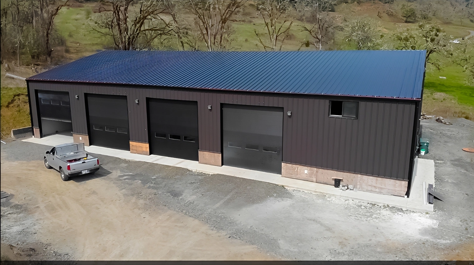 Large industrial warehouse with multiple garage doors.