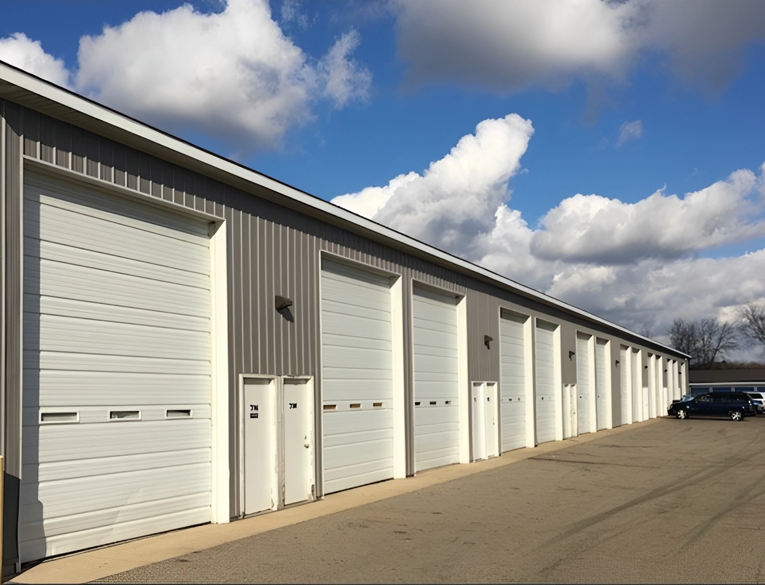 Row of garage doors under blue sky