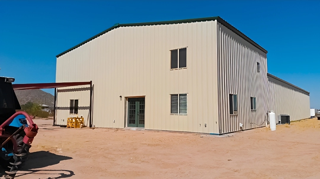 Large metal building in desert landscape