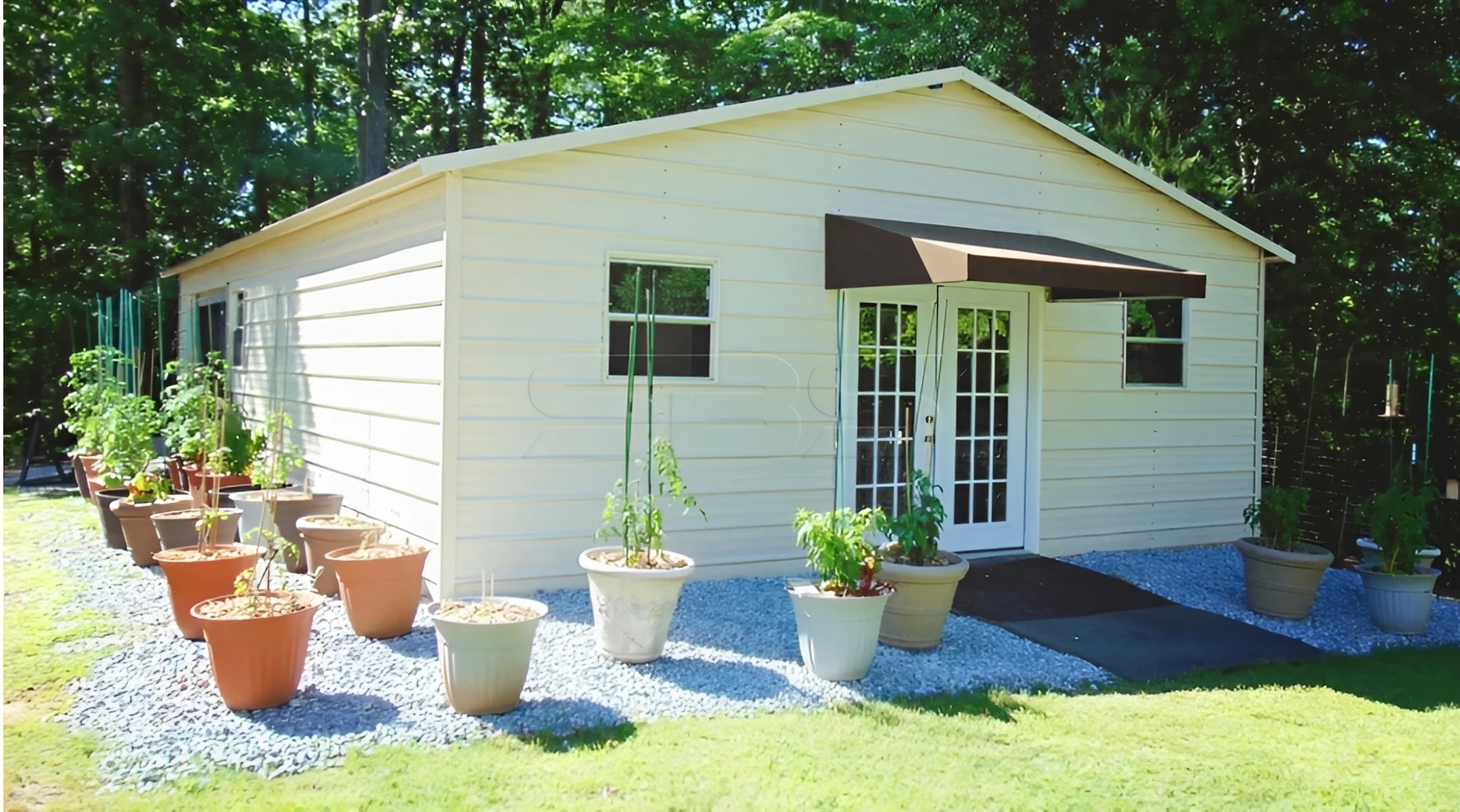 Cottage with multiple flower pots in sunlight