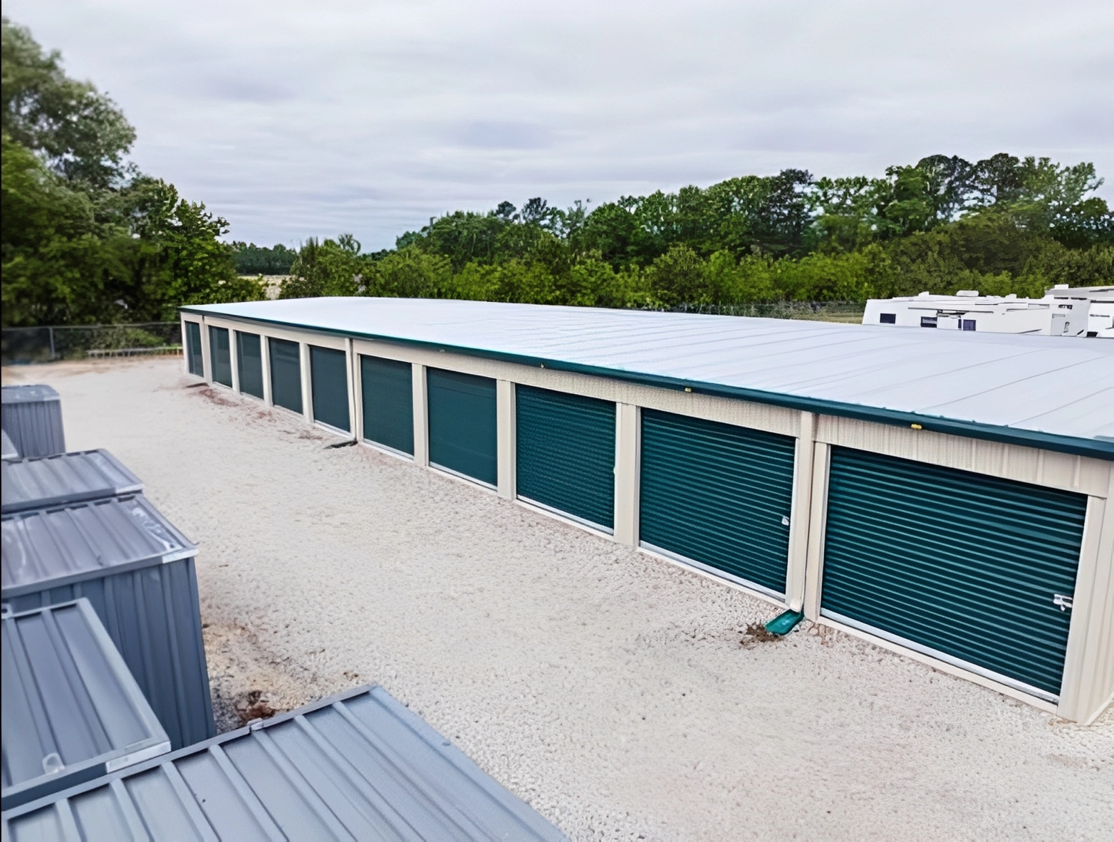 Large storage area with trees behind