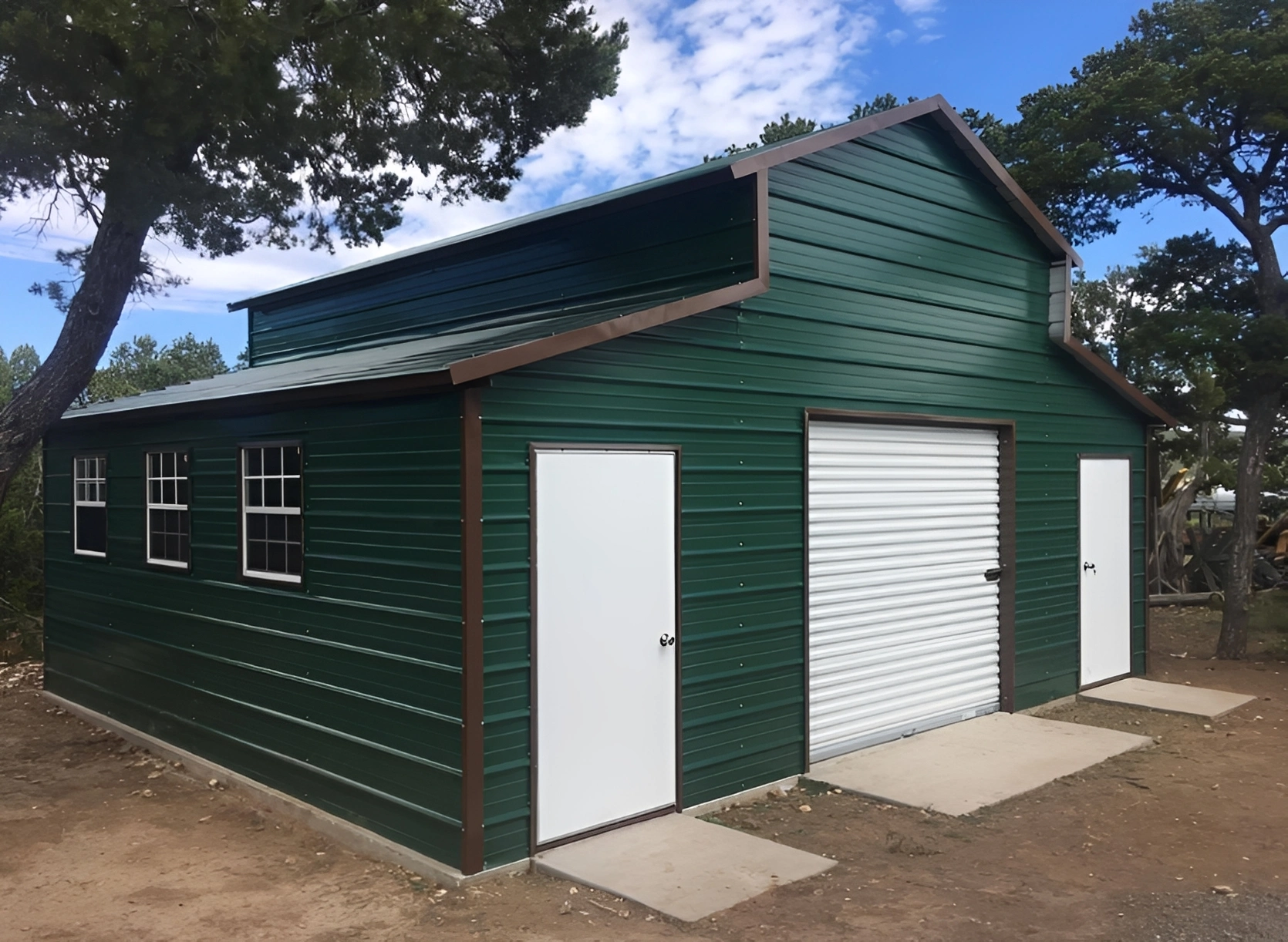 Metal barn surrounded by trees