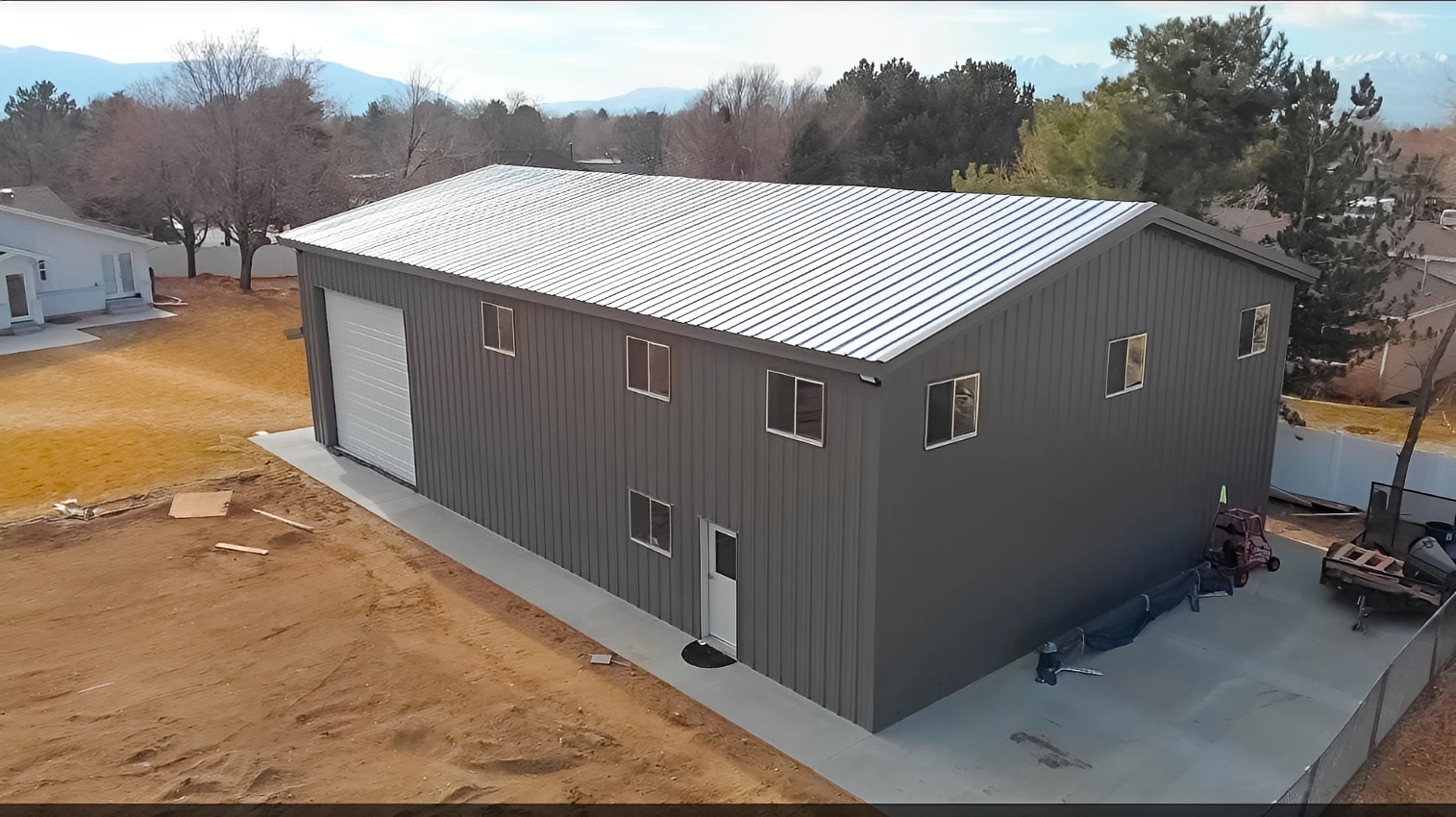 Industrial warehouse with metal roof in yard