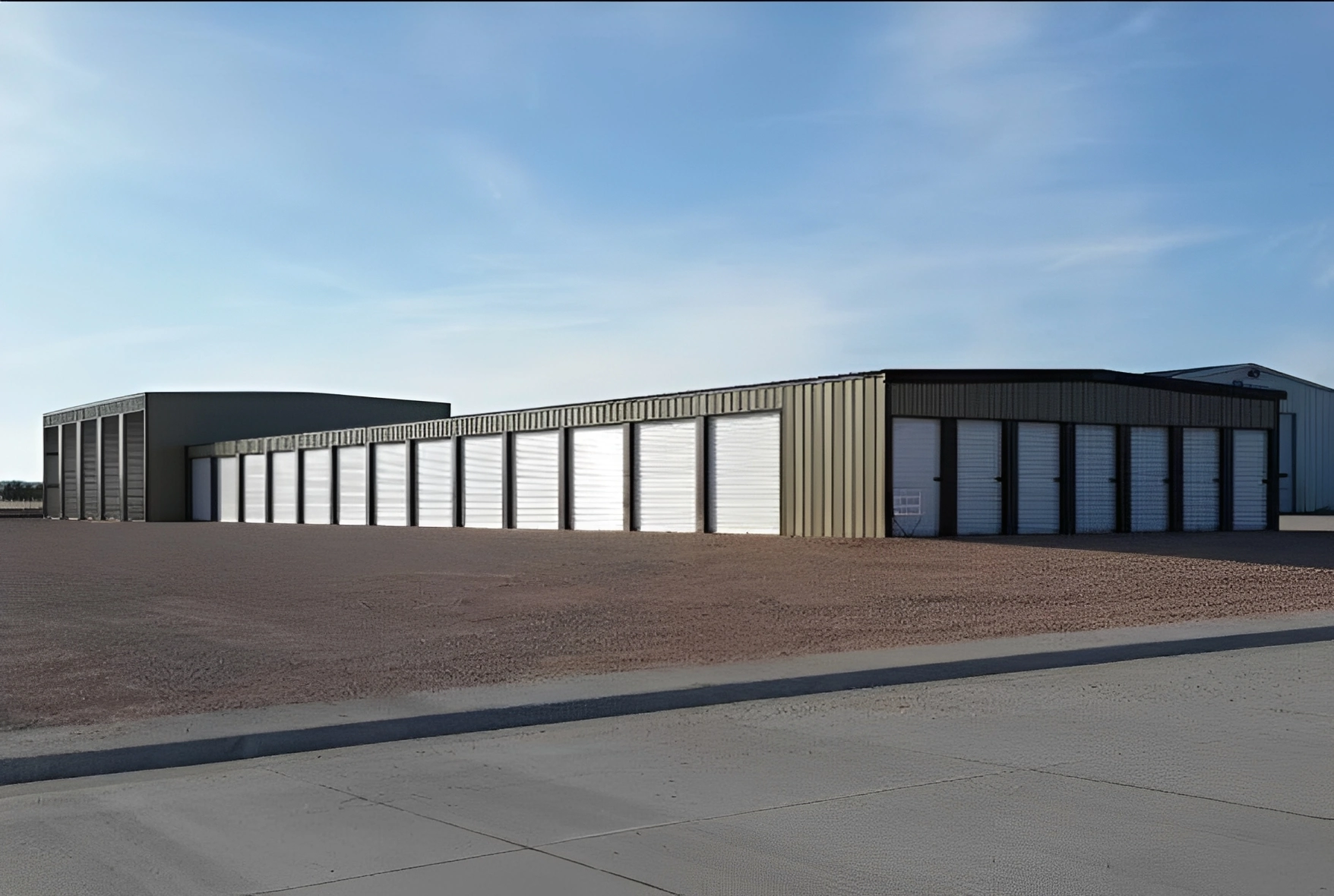 Industrial storage units under a clear sky