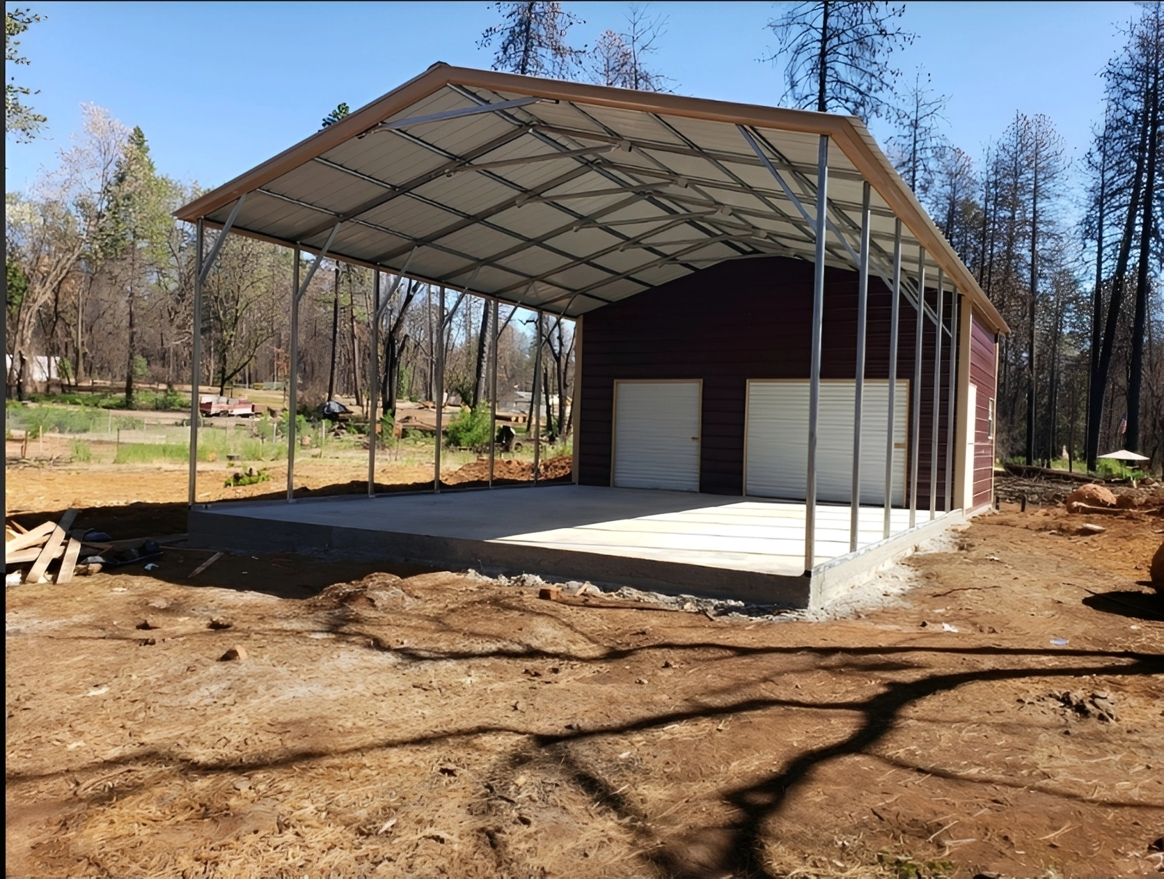 Partially constructed metal garage in forest