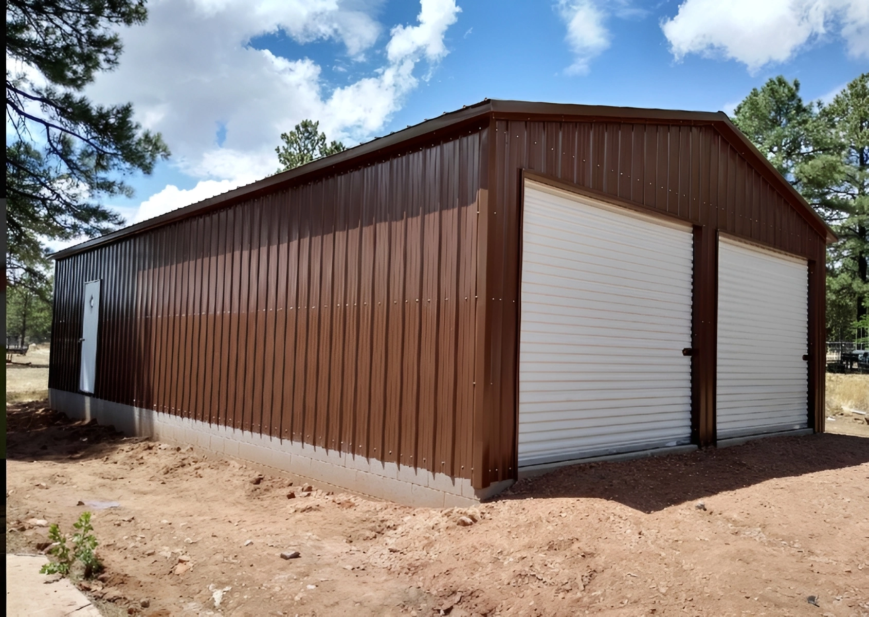 Metal barn structure under clear blue sky