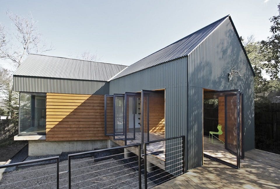 Contemporary home with open doors and patio