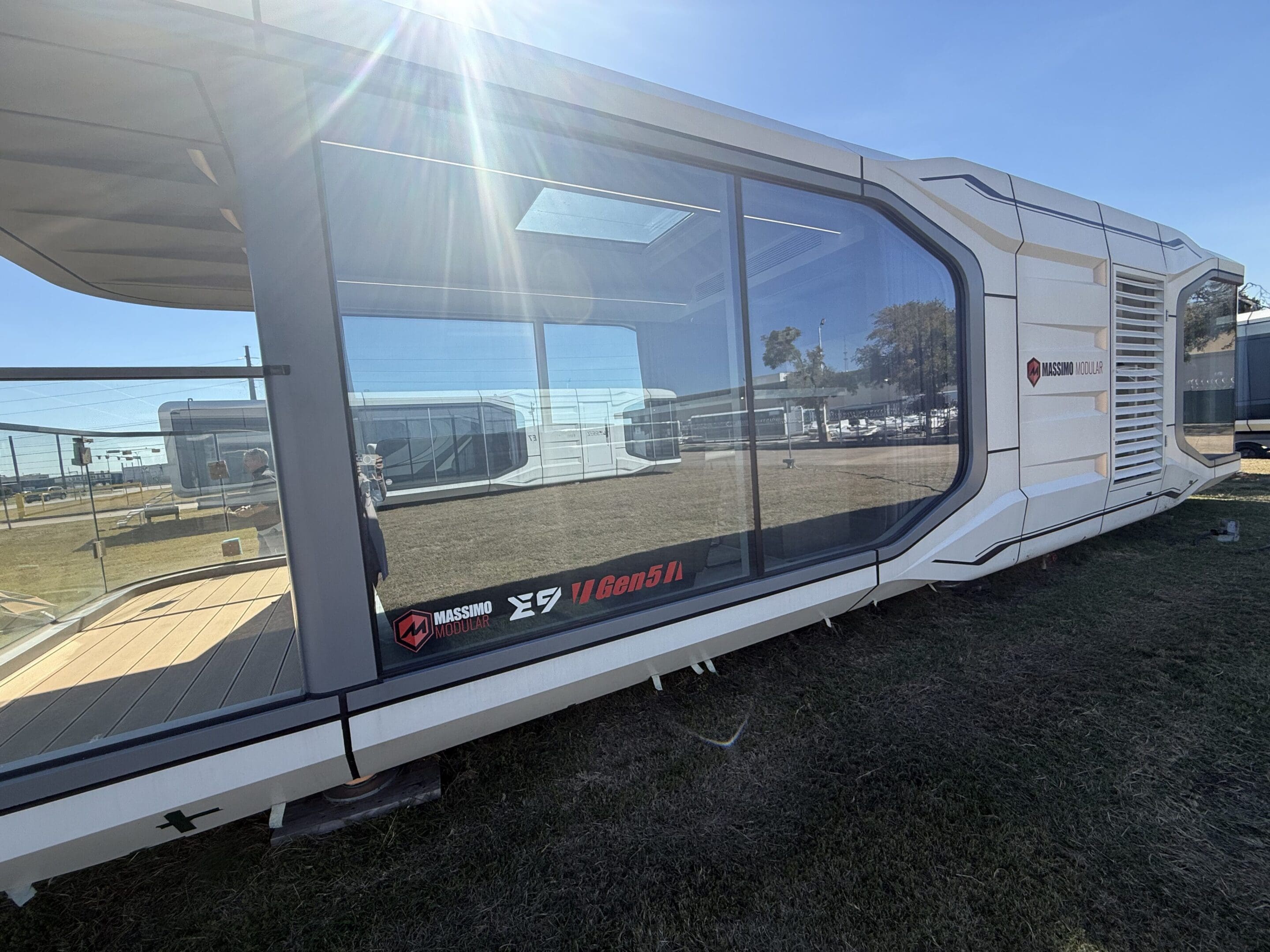 Modern prefabricated building with large windows.