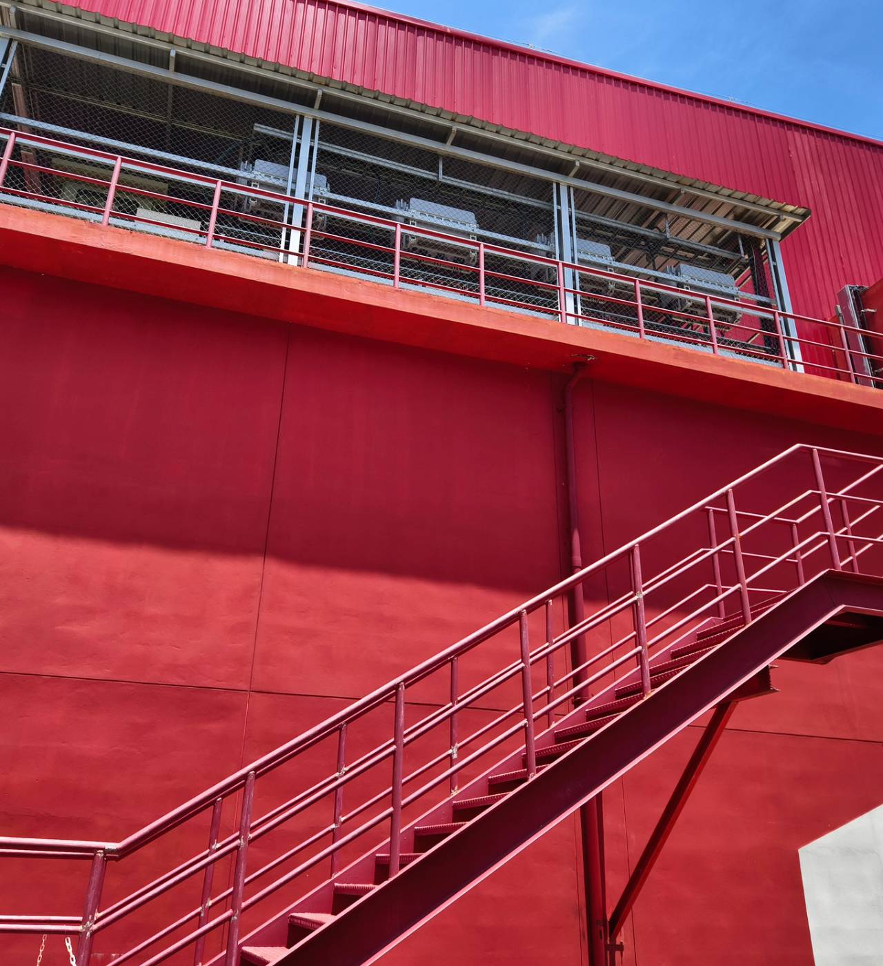 Red building with an external staircase.