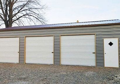 Gray garage building with white doors