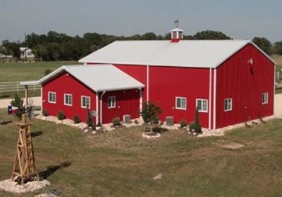 Rural red barn in open field