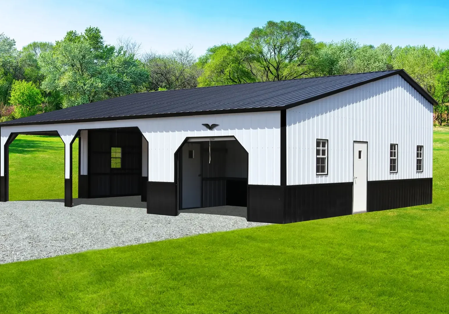 White and black barn with green surroundings.