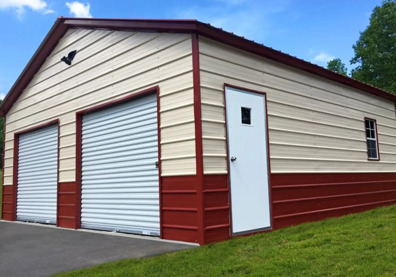 Red and beige metal garage building.
