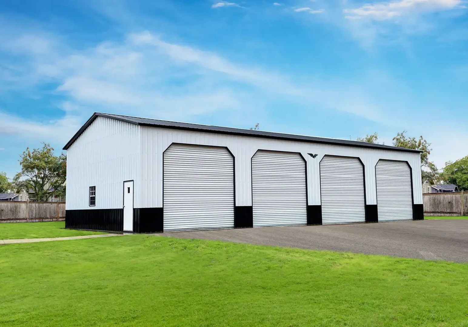 Large metal garage with four doors.