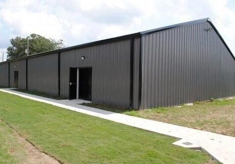 Large gray industrial storage building exterior.