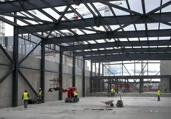 Industrial site under construction with workers